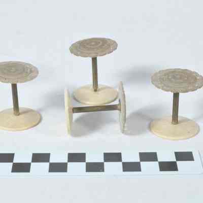 Set of four spools for holding thread
