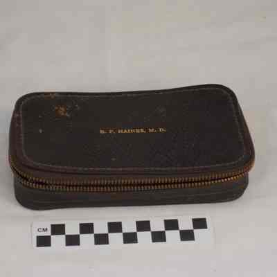 Zippered dark brown leather syringe kit