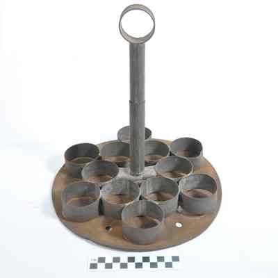 Round, tin implement, possibly a cookie or biscuit cutter