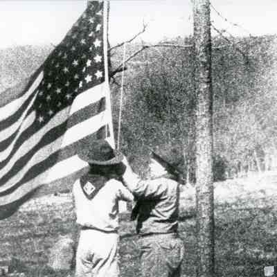 Boy or Cub scouts raising flag