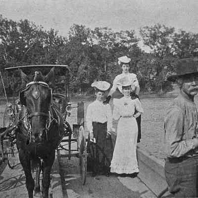 Man, women, and horse and carriage along a ferry at the Bloomery on Route 9