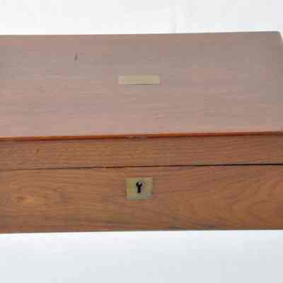 Walnut lap desk in the shape of a rectangular box