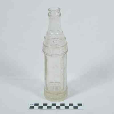 Clear glass soft drink bottle