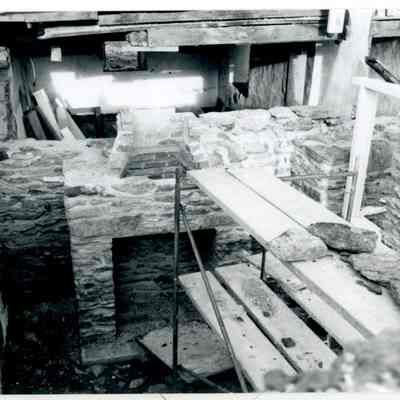 Interior of farmhouse, near fireplace