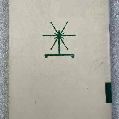 Fibres, Spindles and Spinning - Wheels - Back Cover: Image on the back cover of an 18th Century Reel, used to wind the yarn into skeins.
