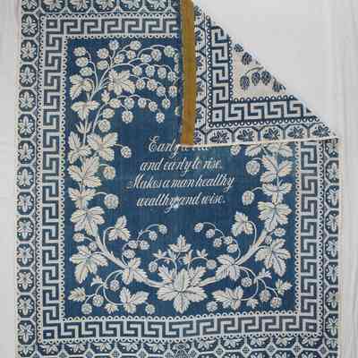 Front of coverlet with corner folded over to show back