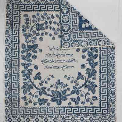 Back of coverlet with corner folded over to show front
