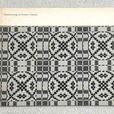 Hand Weaving Pioneer Canada - Front Cover: Book cover titled "Handweaving in Pioneer Canada" featuring a black and white geometric weaving pattern, called "Keep Me Warm One Night".