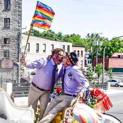Two Men Kissing at Their Wedding During COVID-19