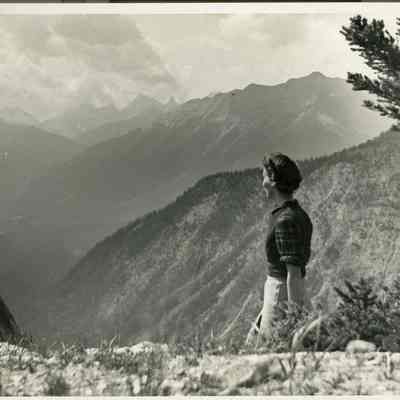 Photograph of Dorothy - 2021.12.291c: Dorothy at Sunshine Valley - The Simpson Pass. Similiar photo to photos a and b, but photographer moved closer. There is black construction paper attached to this photo and cut to fit the dimensions of the photo.