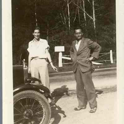 Photo of Dorothy Burnham and Unknown Man Standing by a Car