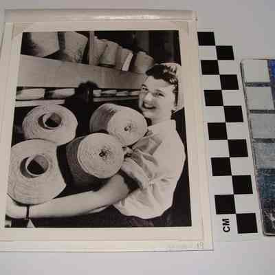 Woman with Spools of Yarn