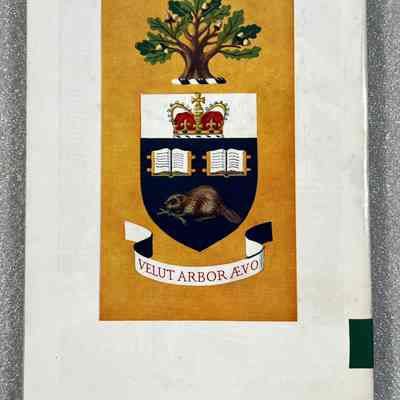 Varsity Graduate - Back Cover: University of Toronto, Coat of arms. With tree, crown, open books, and beaver, and Latin motto "VELUT ARBOR ÆVO" on a yellow background.