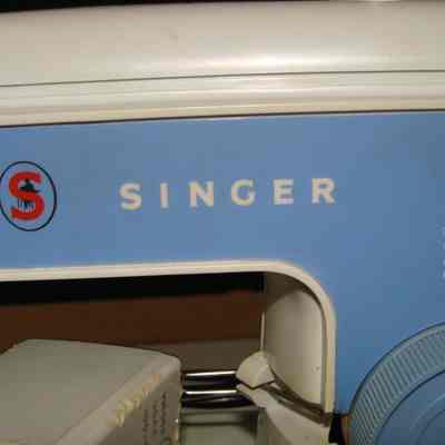 Miniature Sewing Machine by Singer with cover
