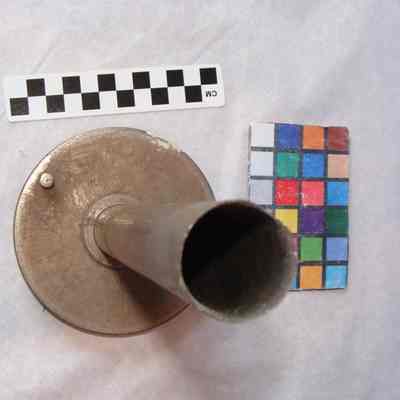 Metal cylinder on round base