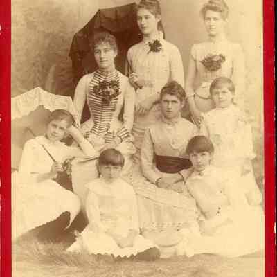 Photo of Dennistoun Girls - 2021.12.290c: Written on the back "1881". Photo was actually taken about 1884 (information from Robert Dennistoun book - 2021.12.288). (L to R) Back row: Margaret, Etta, Mamie; Middle Row: Helen, Annie, Georgie; Front Row: Louie, Jessie.