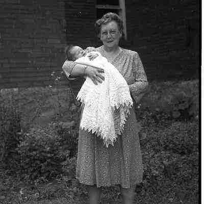 2021.12.311l: A woman holding a baby.