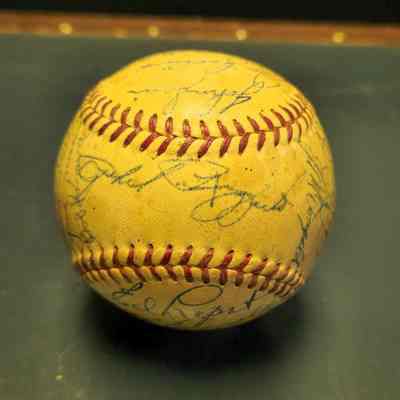 Rizzuto, Phil; Tom Morgan, Frank Shea, Jim McDonald, Hank Bauer, Johnny Mize, Glen Woodling, Charlie Silvera, Mickey Mantle, Bill Dickey, Ed Lopat, Billy Martin and Yogi Berra
