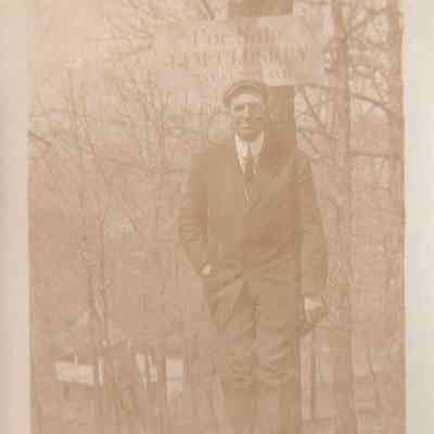 Harris Resting Against a Tree