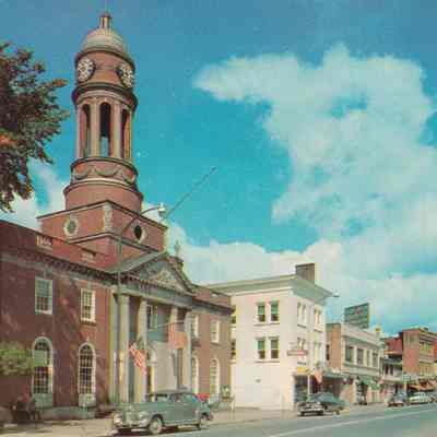 Main Street, Saranac Lake, N. Y. Showing the Town Hall at the Left.