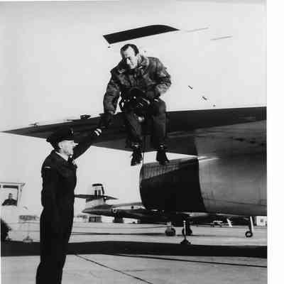 Pilot Peter Cope sitting on Wing of Arrow RL204 on ramp after Diverting to Trenton
