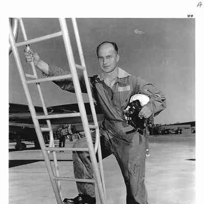 Photo of Pilot Ian Zurakowski starting up ladder to Arrow Cockpit
