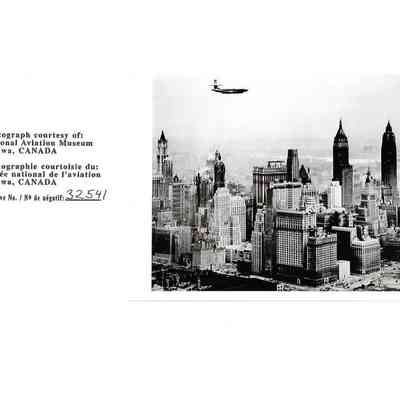 Black and White Photo of Avro Jetliner in Flight over Manhattan, New York