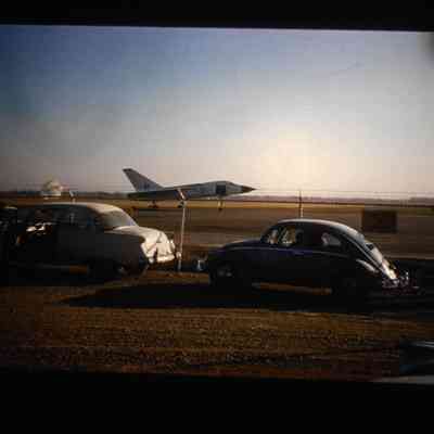 Slide - CF-105 Avro Arrow RL-201 after 6th flight, parachute out, taxiing in, Jan Zurakowski at the controls