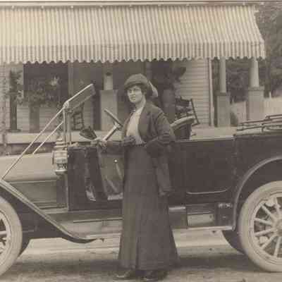 Actual Photo Post Card of a Woman standing beside an old card