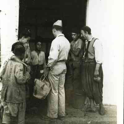 Military Person talking to the Locals
