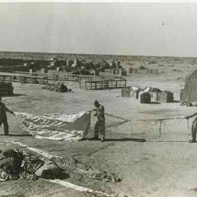Military Personnel working with Parachutes