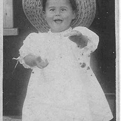 Toddler In Wide Brimmed Straw Hat