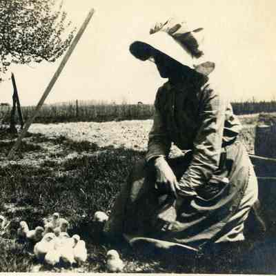 Unidentified Woman w/ Chickens