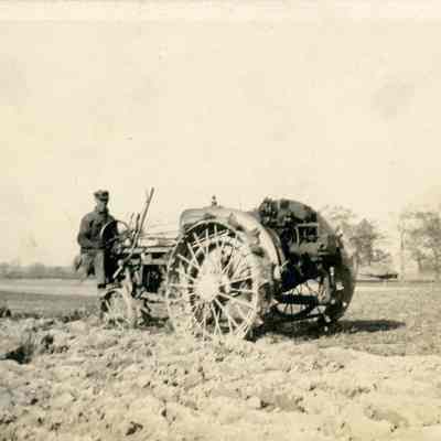 Unidentified Man Driving Tractor