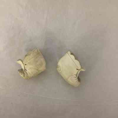 White leather booties. Accession number in sole.