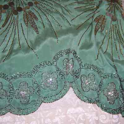 Flapper-era dress, scalloped hem with bead detail