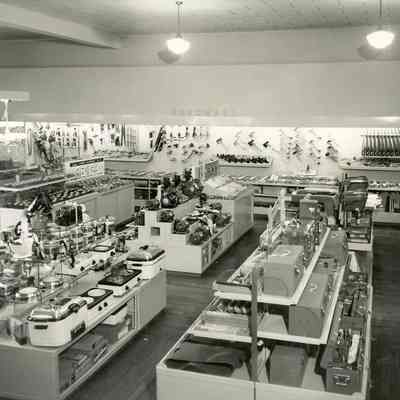 Hardware business, unidentified, interior shot, shelving with merchandise