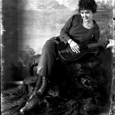 Unidentified female with guital, Glass-plate negative