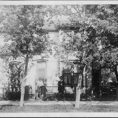 Unidentified People, Dog, & House