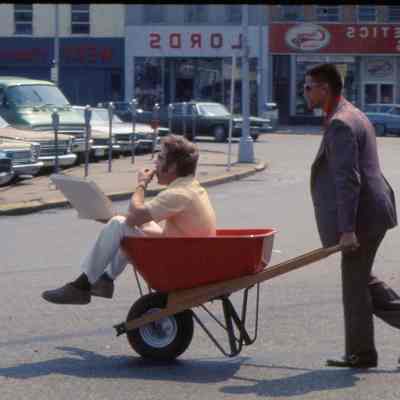Bob Williams in a wheelbarrow