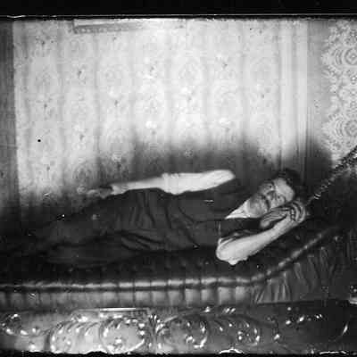 male; he is reclining on his left side