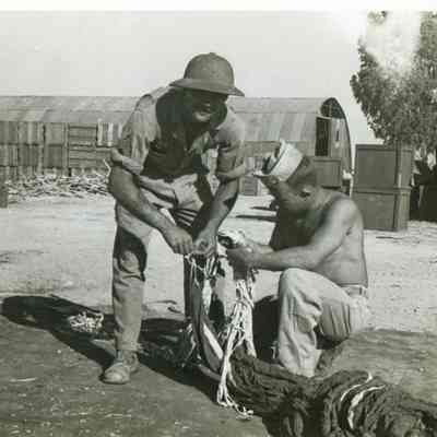 Two Men working with Parachute