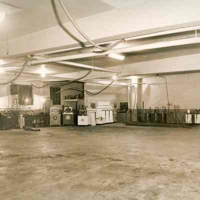 Building, factory or garage, interior, (looks like an auto repair shop)