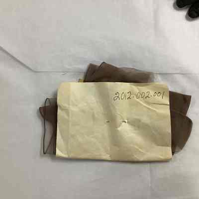 2012.001.002: The object is physically mislabeled as 2012.002.001, an accession number which actually belongs to a photograph in the collection.