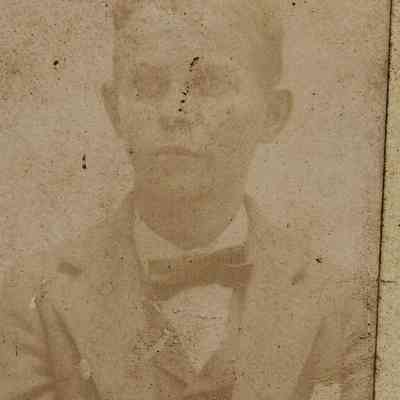 Unidentified Man wearing a Suit with a Vest and a Bow Tie.