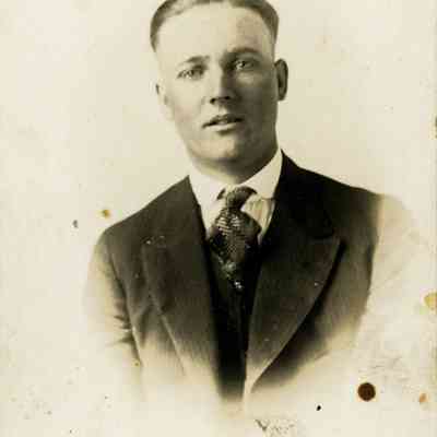 Unidentified Man in Suit and Tie