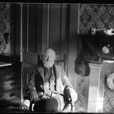  male, seated in high back chair