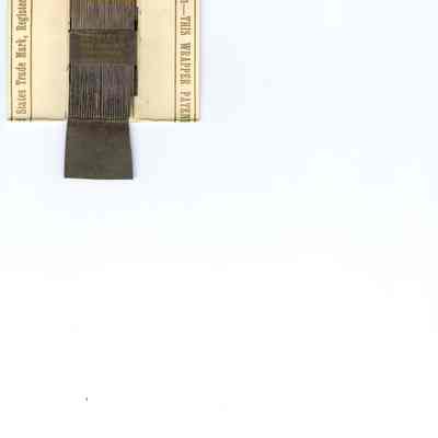 Needles, sewing, packet, open showing needles