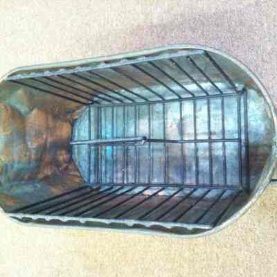 Laundry boiler converted to magazine rack