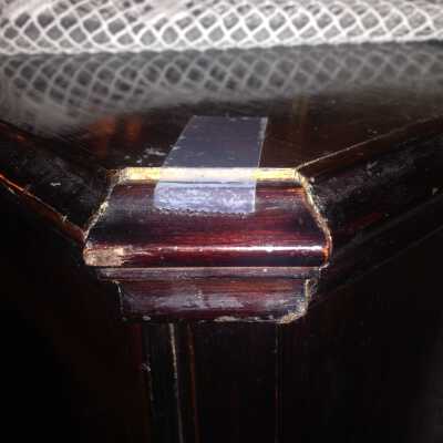 Broken right corner of piano top board